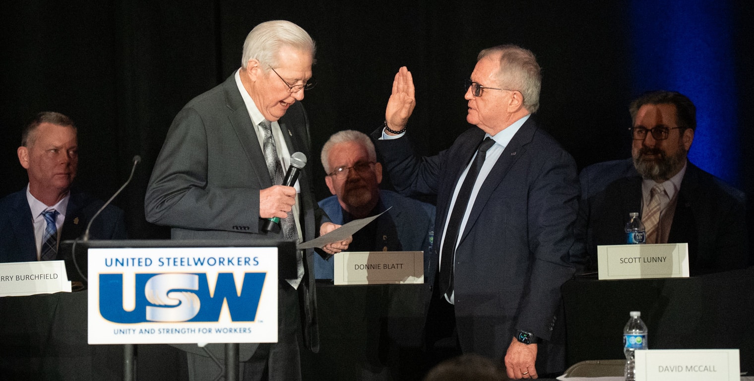 Ken Neumann taking the oath of office from David McCall.