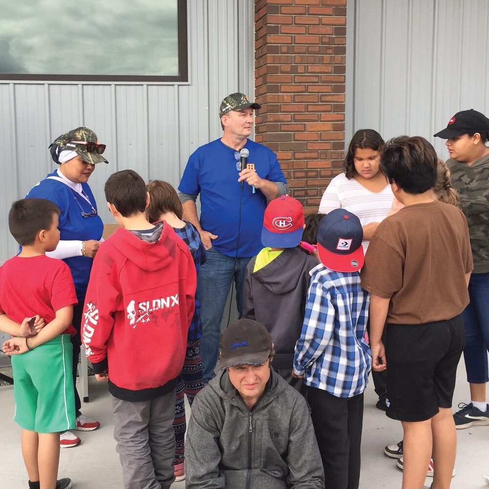 22-Rep-Warren_6166-(in-blue-with-cap)-site-convention-ca-educationfund-support